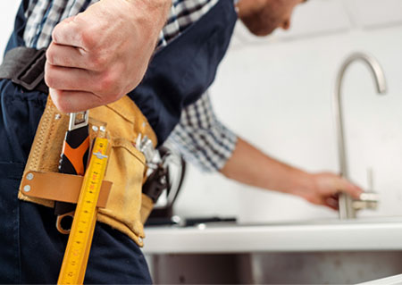 Plumber with practice kit and tools